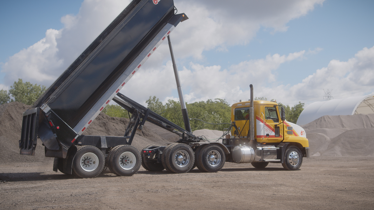 end dump trailer in an upright position to show how an end dump trailer dumps
