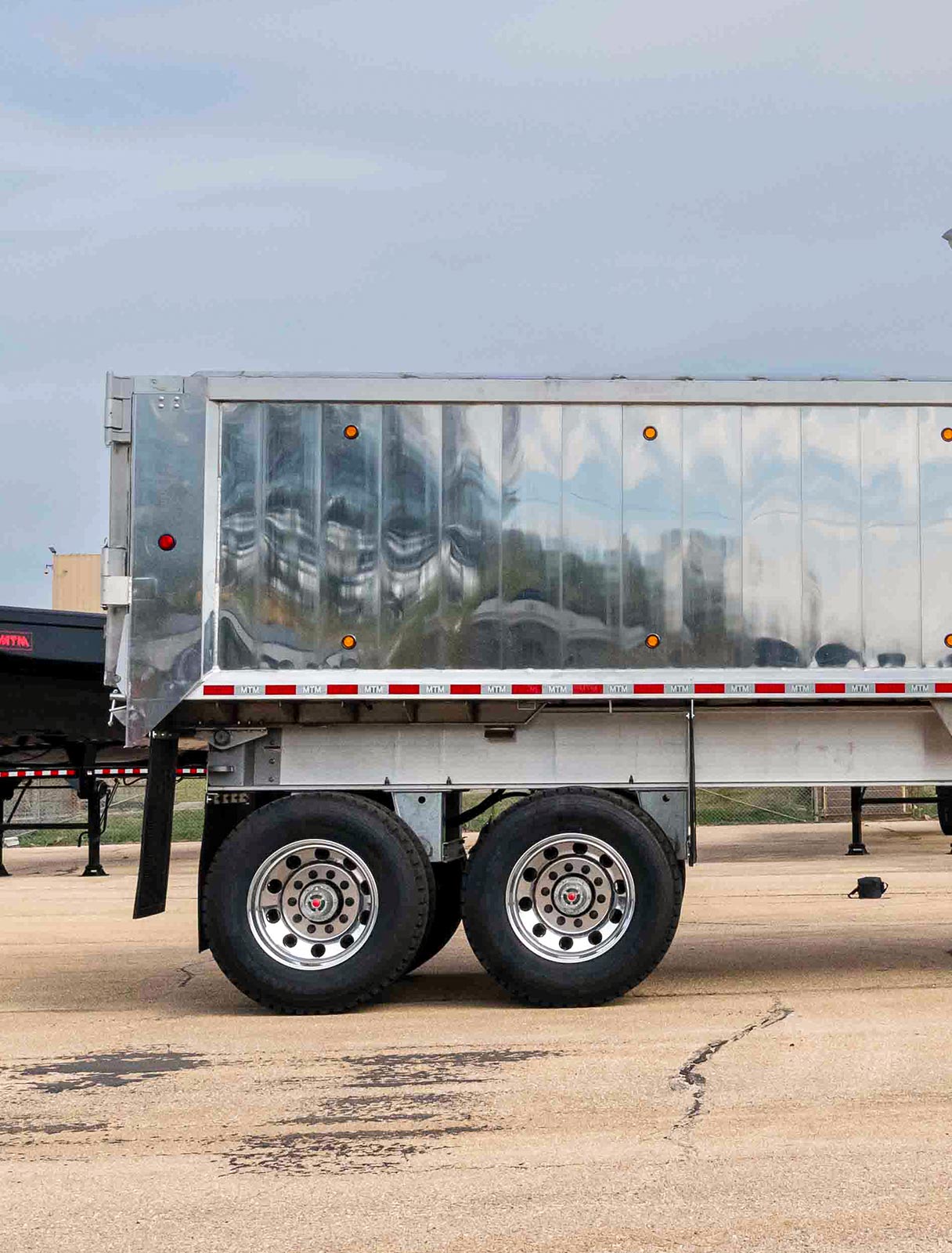 Rear view of an MTM Aluminum Full Frame end-dump trailer