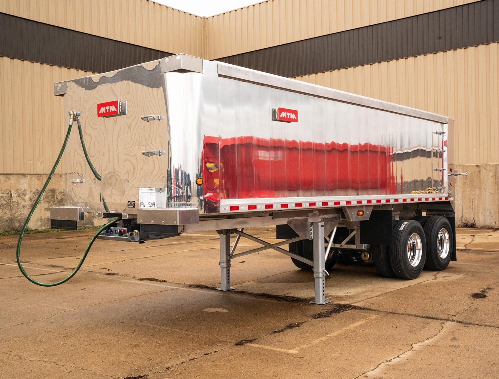 A front view of an MTM Short-Frame Aluminum End Dump Trailer